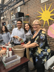 Nadia and Arif Virani with Parkdale High Park community leaders building an urban garden